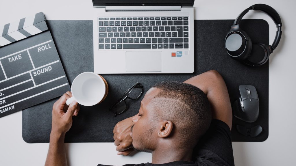 person sleeping on desk